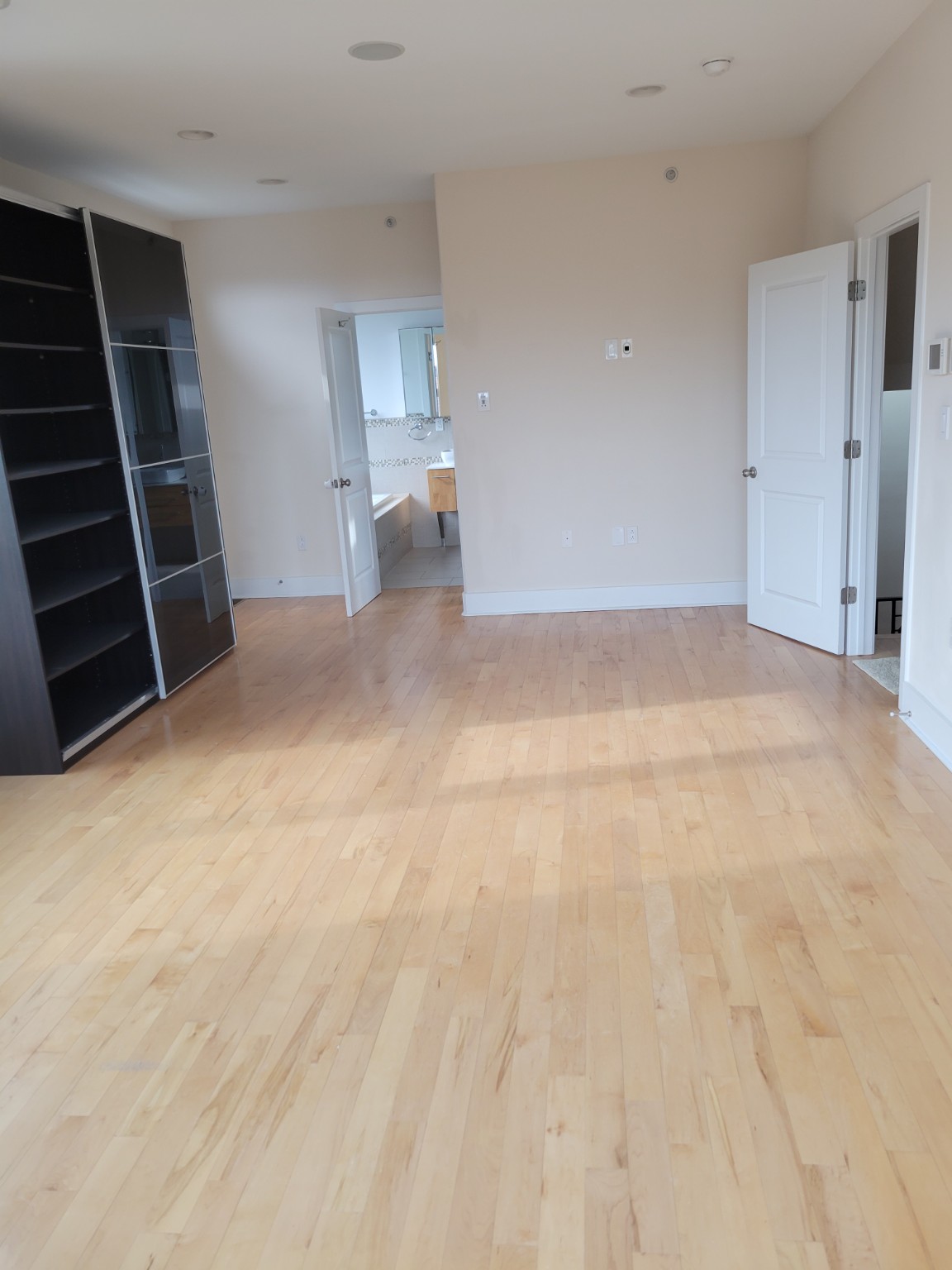 Bright room with natural hardwood flooring