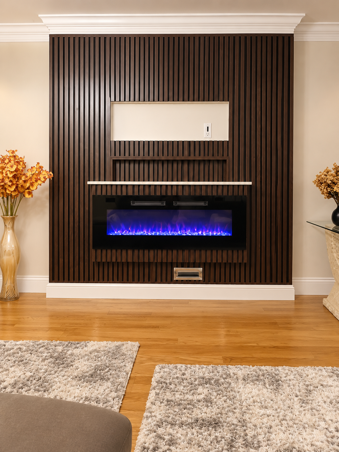 Custom dark wood slat feature wall with electric fireplace and floating shelf